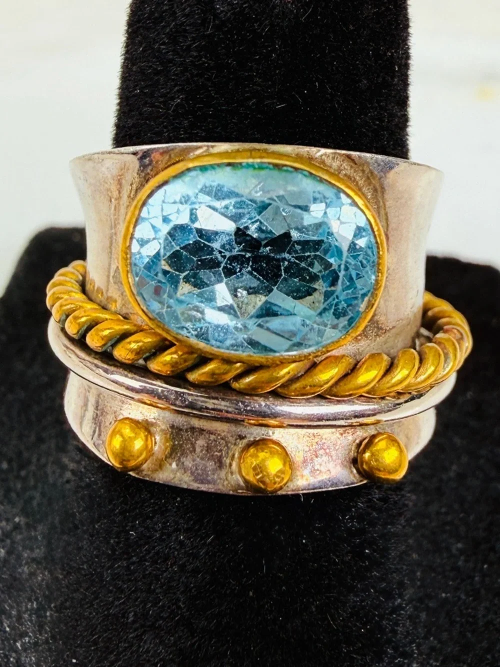 Beautiful size 5 1/2 Silvertone and bronze stamped 925 blue topaz, spinner ring
